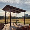 Manchester Shelter with Wood Grain Western Red Cedar Aluminium Slat Screen